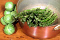 copper pot with green vegetables